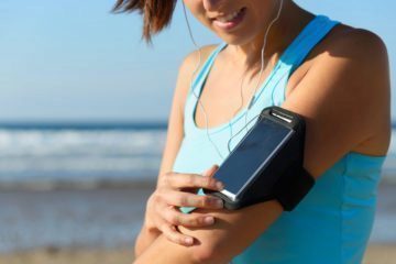 Sporty woman with phone sport band Sporty woman with phone sport band