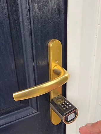 WELOCK smart lock installed on blue door with gold handle elegant and modern look